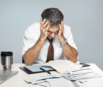 Frustrated Man Worries About Economy, Unpaid Bills and Retiremen
