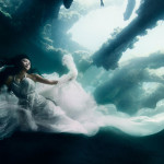 Beautiful Women Floating Around an Underwater Shipwreck in Bali